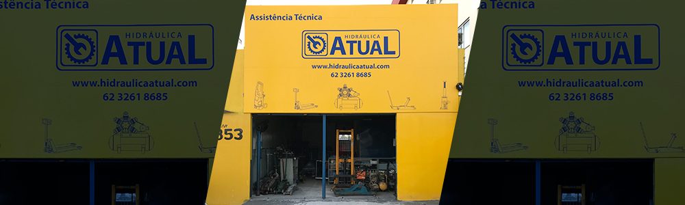 Fachada amarela da Hidráulica Atual com a logomarca da empresa